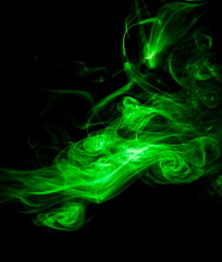 Green smoke on black background