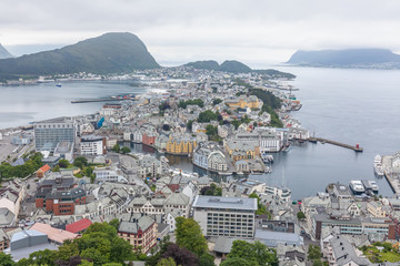Alesund, Norway - June 12, 2016: Aerial view of Alesund cityscape and surroundings. View from the mountain Aksla at the city of Alesund, Norway. selective focus
