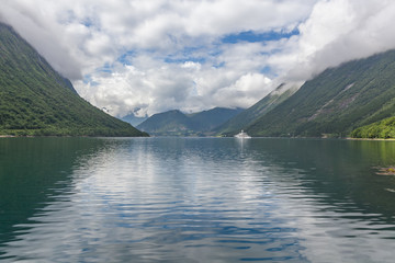 Fototapeta na wymiar Beautiful Norwegian landscape. view of the fjords. Norway ideal fjord reflection in clear water. selective focus