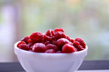 Bowl of raspberries. Selective focus.