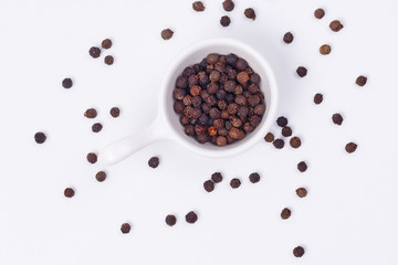 Black pepper in a small dish.