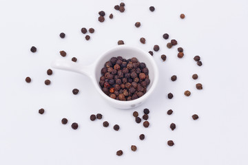 Black pepper in a small dish.