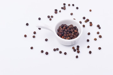 Black pepper in a small dish.