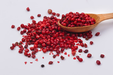 Red pepper in a wooden spoon.