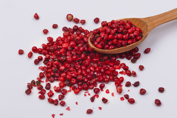 Red pepper in a wooden spoon.