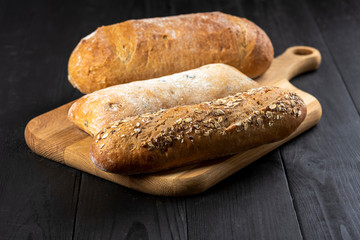 a loaf of bread on a wooden board