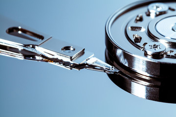 An open computer hard drive for repair. HDD. Components for ps. Storage and restoration of digital...