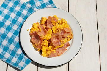Eggs with ham for breakfast on white background