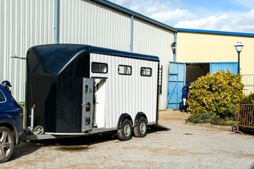 horse vehicle .  Carriage for horses . Auto trailer for transportation of horses . transportation livestock .