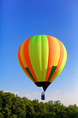 Fototapeta na wymiar Balloon Festival. Flying balloons against the blue sky.