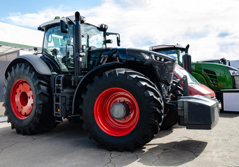 tractor with big wheels, machine for agricultural work and transportation of goods, close-up