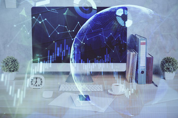 Forex graph hologram on table with computer background. Double exposure. Concept of financial markets.