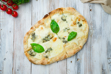 Roman pizza four cheeses on Roman dough, pinsa