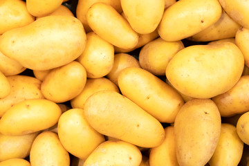Fresh organic bio clean potatoes on a store counter. Ideal for background and texture.