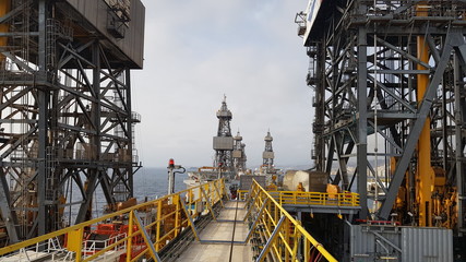 Fototapeta na wymiar Drillships and derrick view from the onboard knuckle boom crane