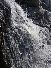 Rainwater is flowing down the rock