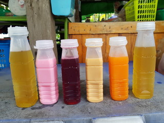 Closeup of juice and milk for sale in the park.  Healthy refreshment concept.
