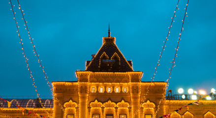 Facade of the Moscow GUM (State Department store) on red square. The building with garlands is...