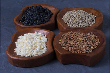 four bowls full of seeds