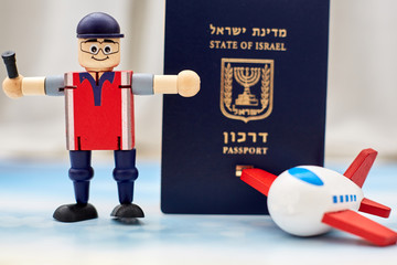 airport employees toy shows a ban on entering the country from quarantine against an Israeli...