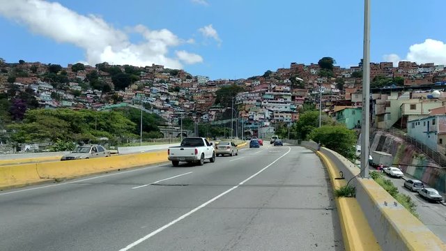 Caracas, Venezuela - July 20, 2019: The track on the way to Caracas with the slums of bario.