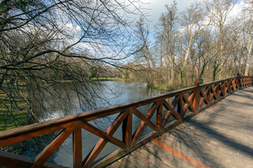 Fototapeta na wymiar Wooden bridge at the english garden of the famous Brunszvik Pala