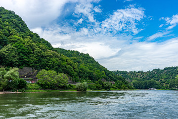 Fototapeta na wymiar Germany, Rhine Romantic Cruise, Kelani River, a large body of water surrounded by trees with Kelani River in the background