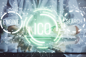 Cryptocurrency hologram, bitcoin, ico theme over hands taking notes background. Concept of...