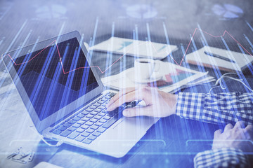 Double exposure of forex chart with man working on computer on background. Concept of market analysis.