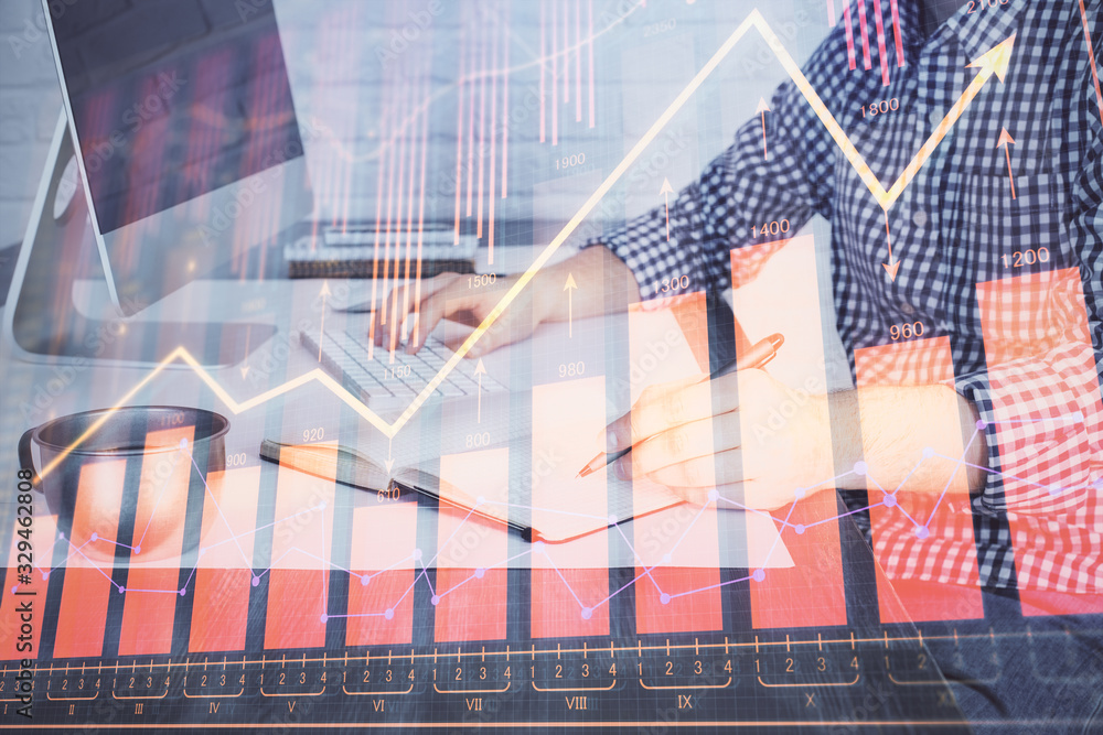 Poster double exposure of stock market chart with man working on computer on background. concept of financi