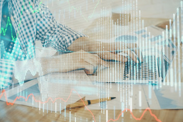 Multi exposure of stock market chart with man working on computer on background. Concept of financial analysis.
