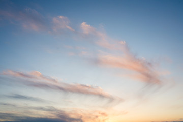 Naklejka premium blue sky during sunset with colourful and vibrant clouds