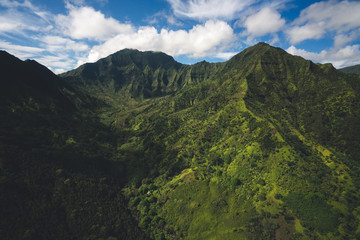 Naklejka na ściany i meble Aerial View of Kauai Landscape in Hawaii with Rugged Mountains and Lush Forests