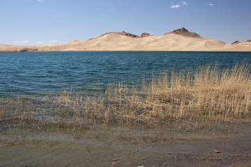 Cloudy view on steppe and lake. Mongolia