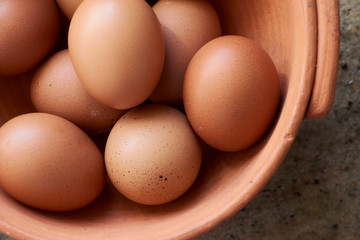 Close up of eggs in a pottery basket