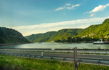 Fototapeta premium Germany, Hiking Frankfurt Outskirts, a wooden bench sitting next to a body of water