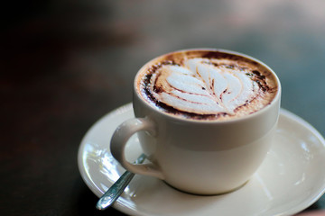 Latte coffee cup at coffee shop.