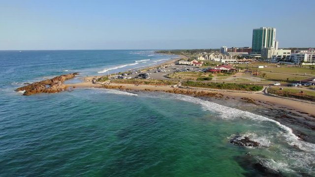beautiful beachfront and rocks at Pollock Beach revealed in aerial slider movement