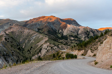 Gravel road heading to La Hoya ski center during sunset in Esquel, Patagonia, Argentina