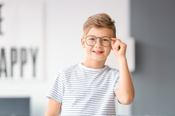 Little boy wearing glasses at home © Pixel-Shot