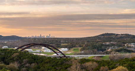 View of the Austin 360 Bridge With Golf Course and Austin Skyline in the Background