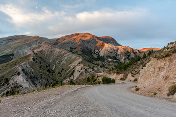 Gravel road heading to La Hoya ski center during sunset in Esquel, Patagonia, Argentina