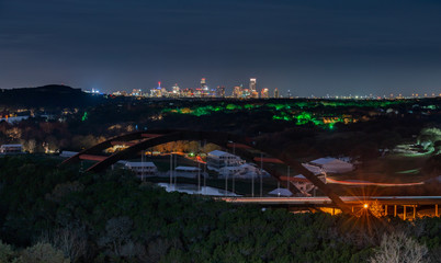 Wide Angle View of the  Light up Austin Skyline With the 360 Bridge in the Foreground