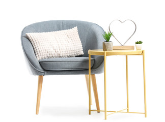 Fototapeta na wymiar Modern armchair and table on white background