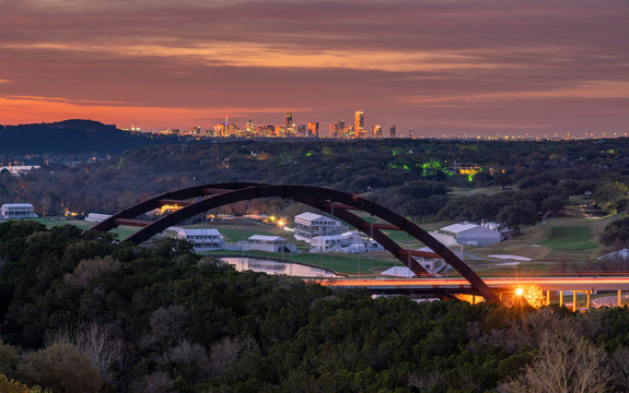 Early Sunrise View of the Light up Austin Skyline With the 360 Bridge in the Foreground