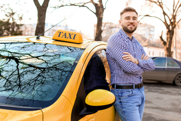 Portrait of handsome taxi driver outdoors