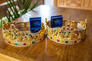 Pair of wedding rings in cases with holy crowns orthodox wedding tradition