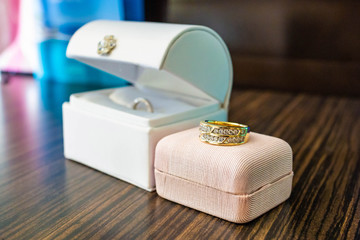 Pair of beautiful wedding rings in cases close up