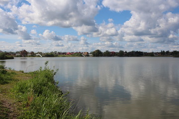 village on the Bank of the river in autumn near the lake