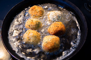 Fry the arancini ball in the oil